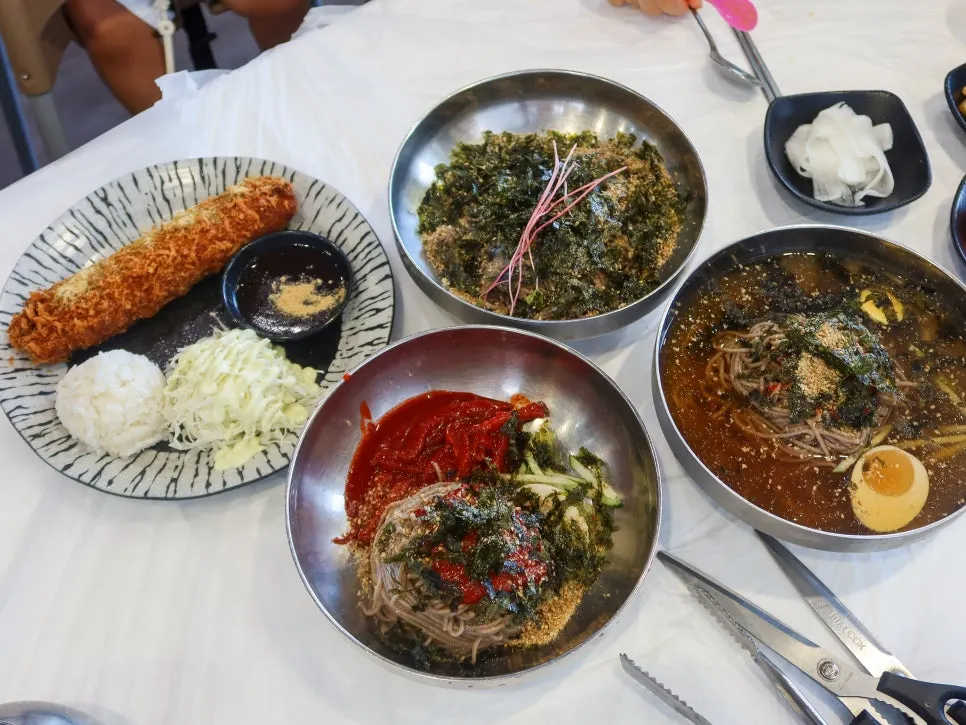 Full spread of ordered makguksu and roll cutlet