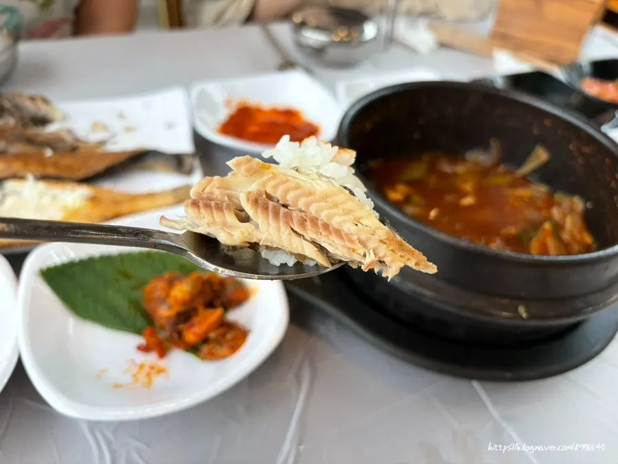 Grilled fish served alongside the side dishes