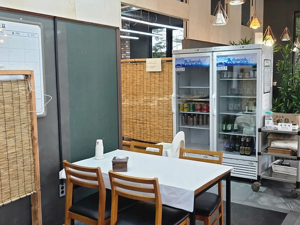Indoor table seating at Saimdang Bueok