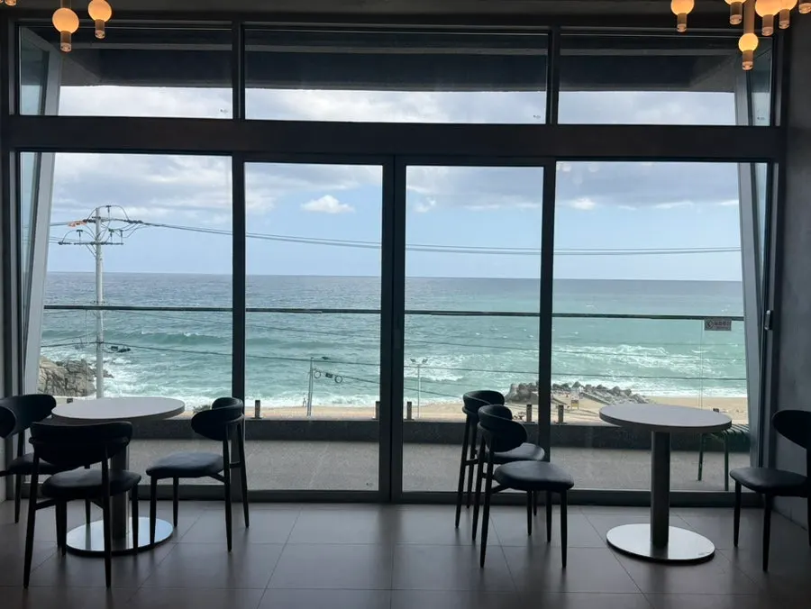 Sacheonjin Beach ocean view through the 3rd-floor floor-to-ceiling windows