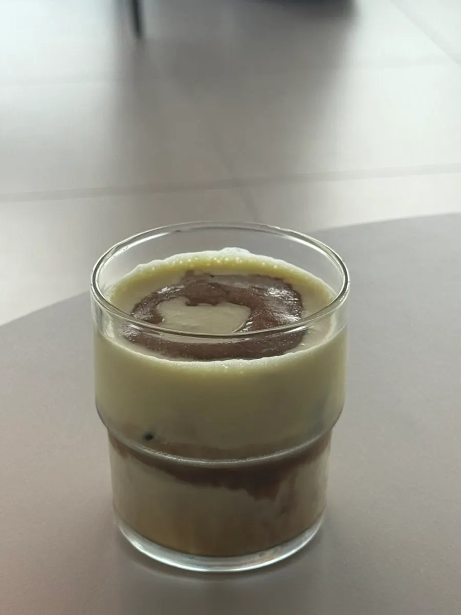 Corn cream shot latte topped with cream