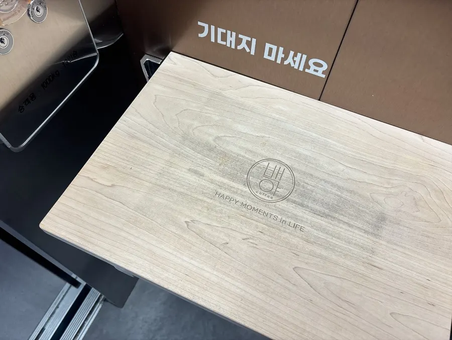 Inside Baegya Coffee's elevator with a tray holder