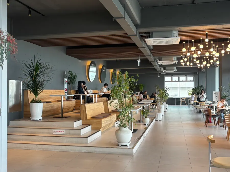 Baegya Coffee's spacious hall and table layout
