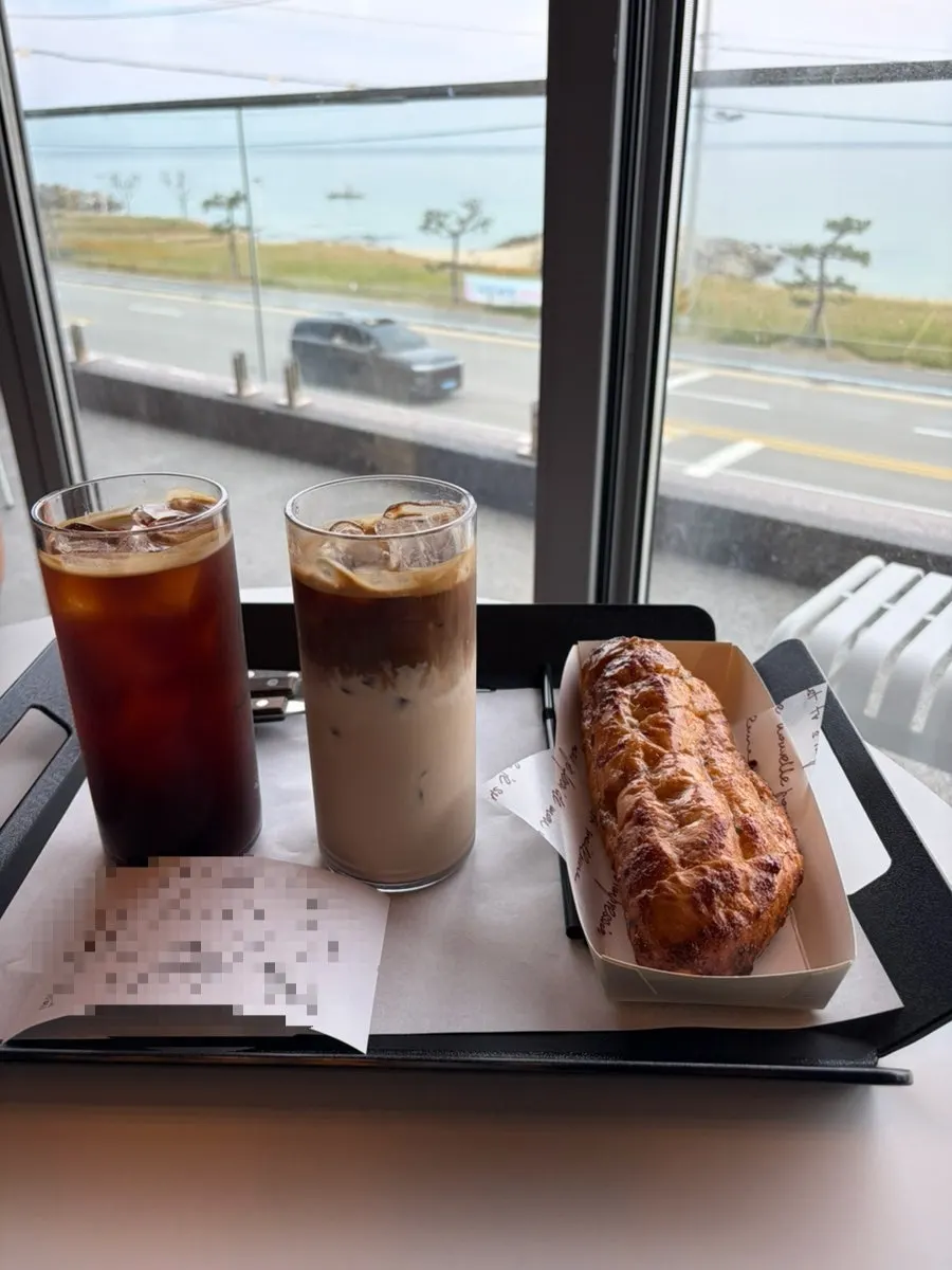 Crispy pastry bread and coffee together on a table