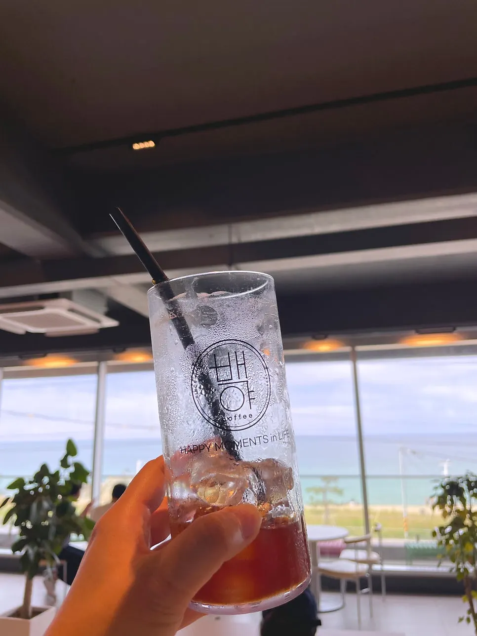 Drinks and ocean view from a window table