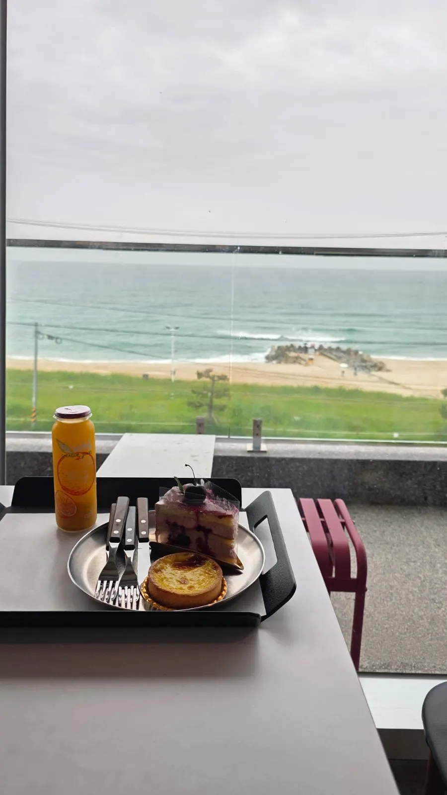 The Gangneung sea seen through Baegya Coffee's floor-to-ceiling windows