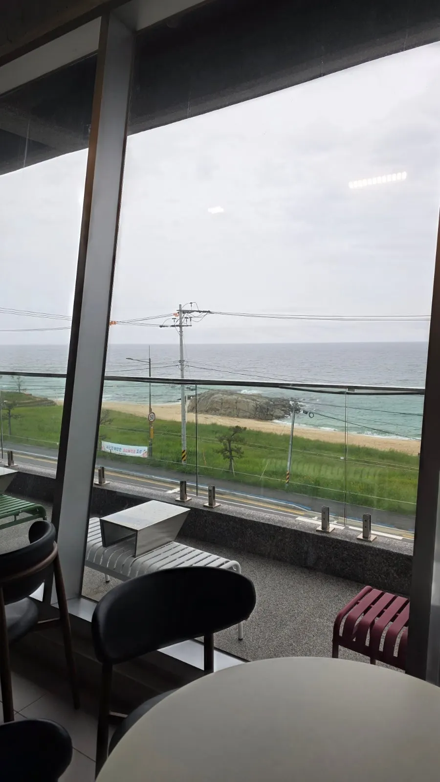 View of Sageunjin Beach from a window seat on a cloudy day