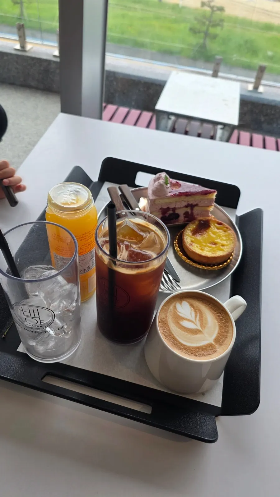 A display case with various baked goods at Baegya Coffee