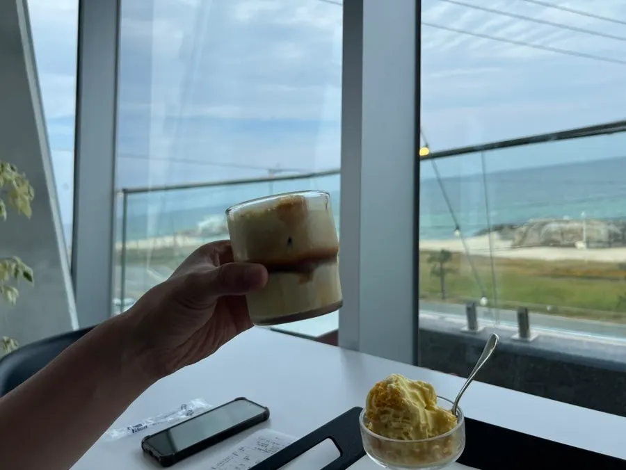 Oksigi ice cream by the window with the sea in view