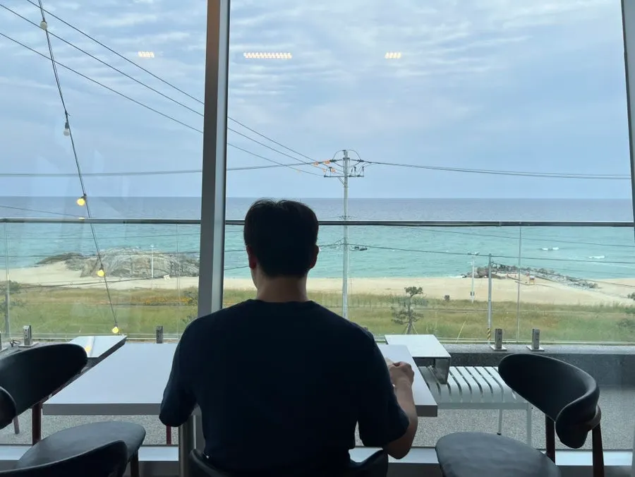 Sageunjin Beach seen from a window seat at Baegya Coffee