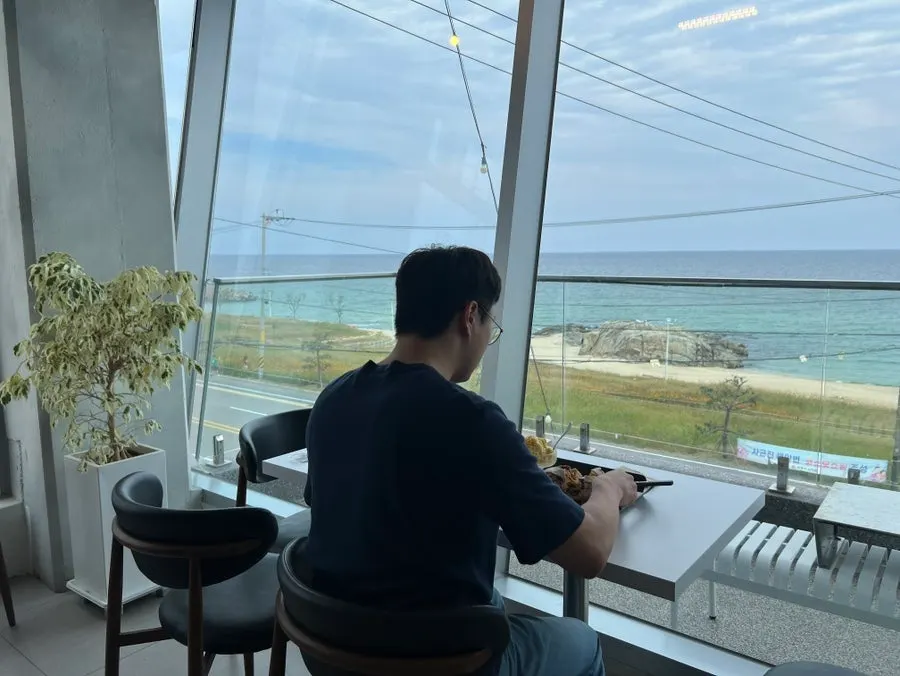 Ocean view spread out beyond the café window