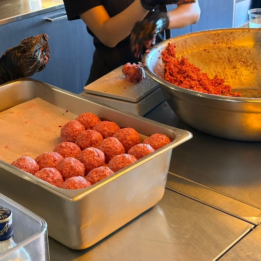 Staff making burger patties
