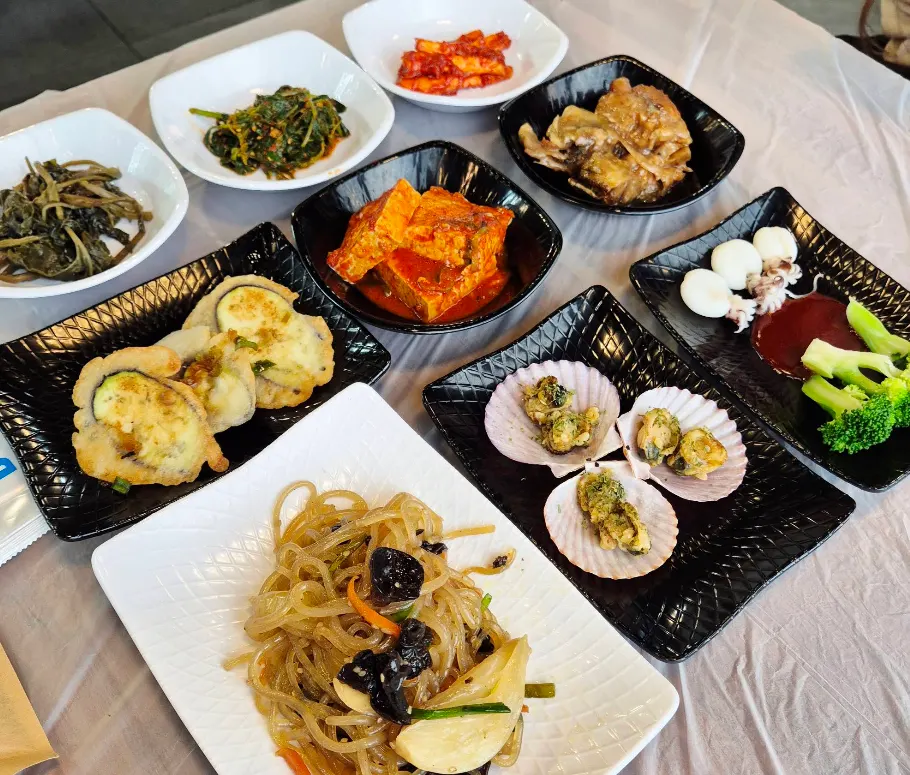 Full table spread of side dishes at Saimdang Bueok