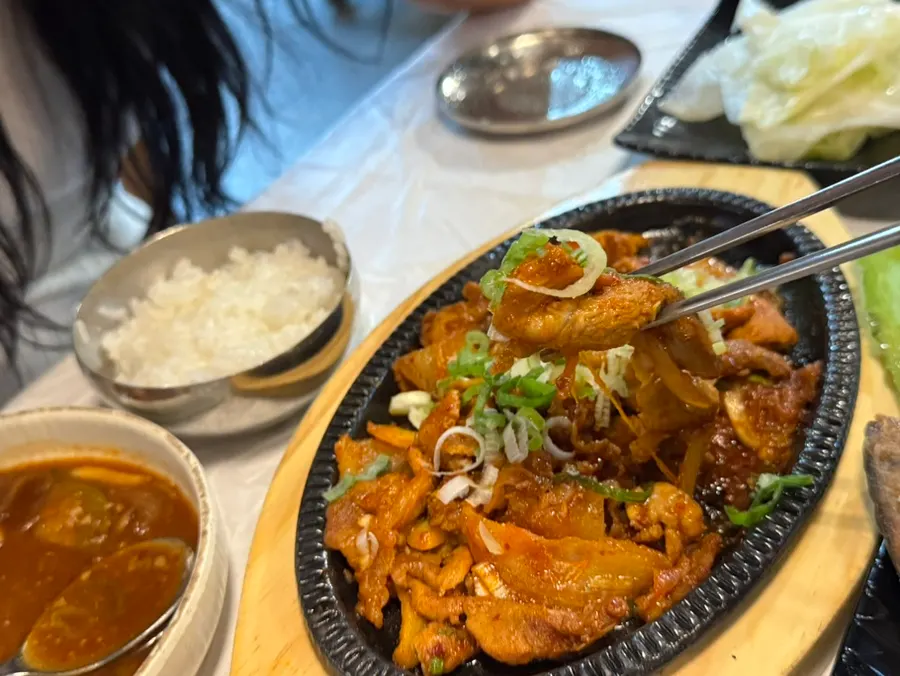 A whole grilled fish enjoyed by the child