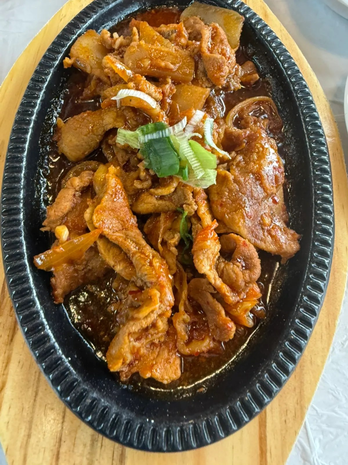 Golden grilled fish served on a large plate