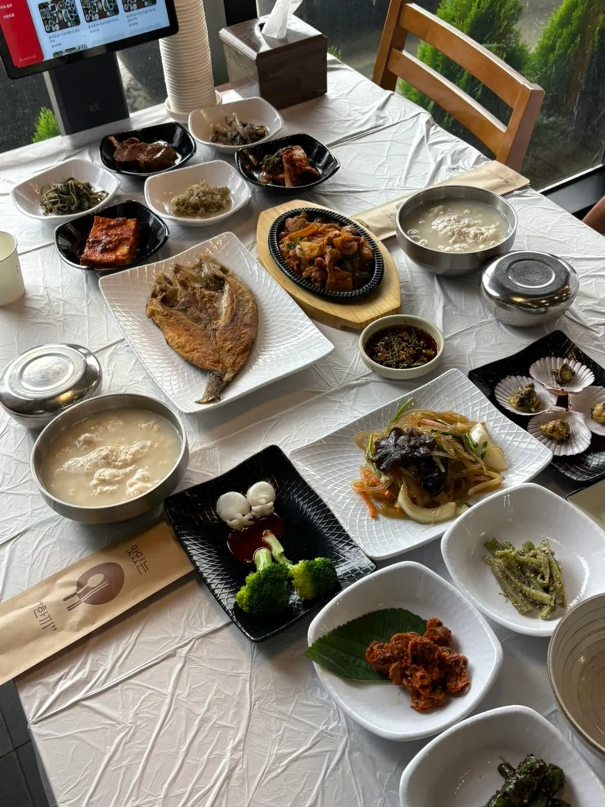 Table fully packed with side dishes for the Saimdang Set