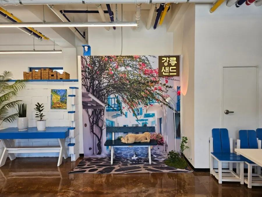 White and blue interior with potted plants