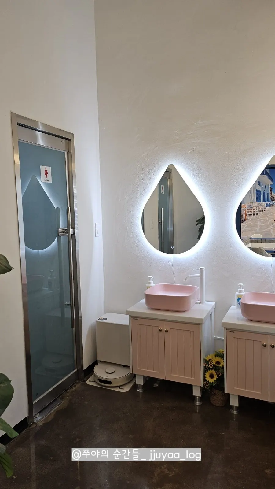 3rd floor restroom with a pink pastel-toned sink