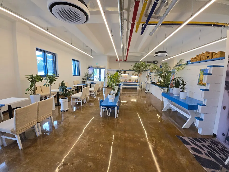 Stairs and outdoor space leading up to the 2nd floor of Gangneung Sand Main Branch