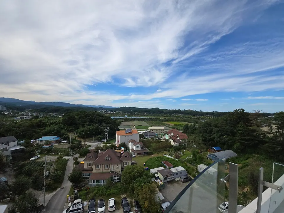 View of houses and mountains from the 5th floor observation deck at Gangneung Sand Main Branch