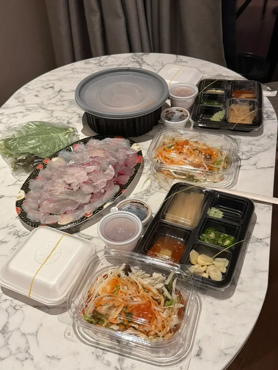 Preparing sashimi takeout during a Gangneung trip