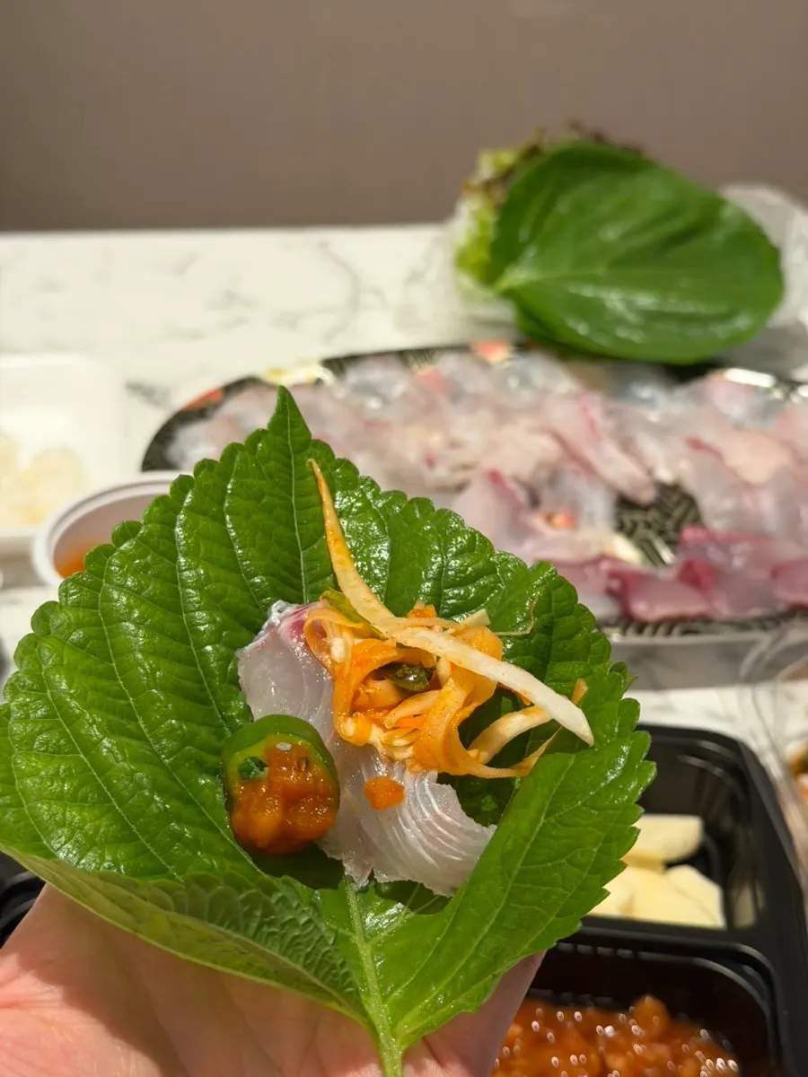 Making aged-kimchi fish sushi