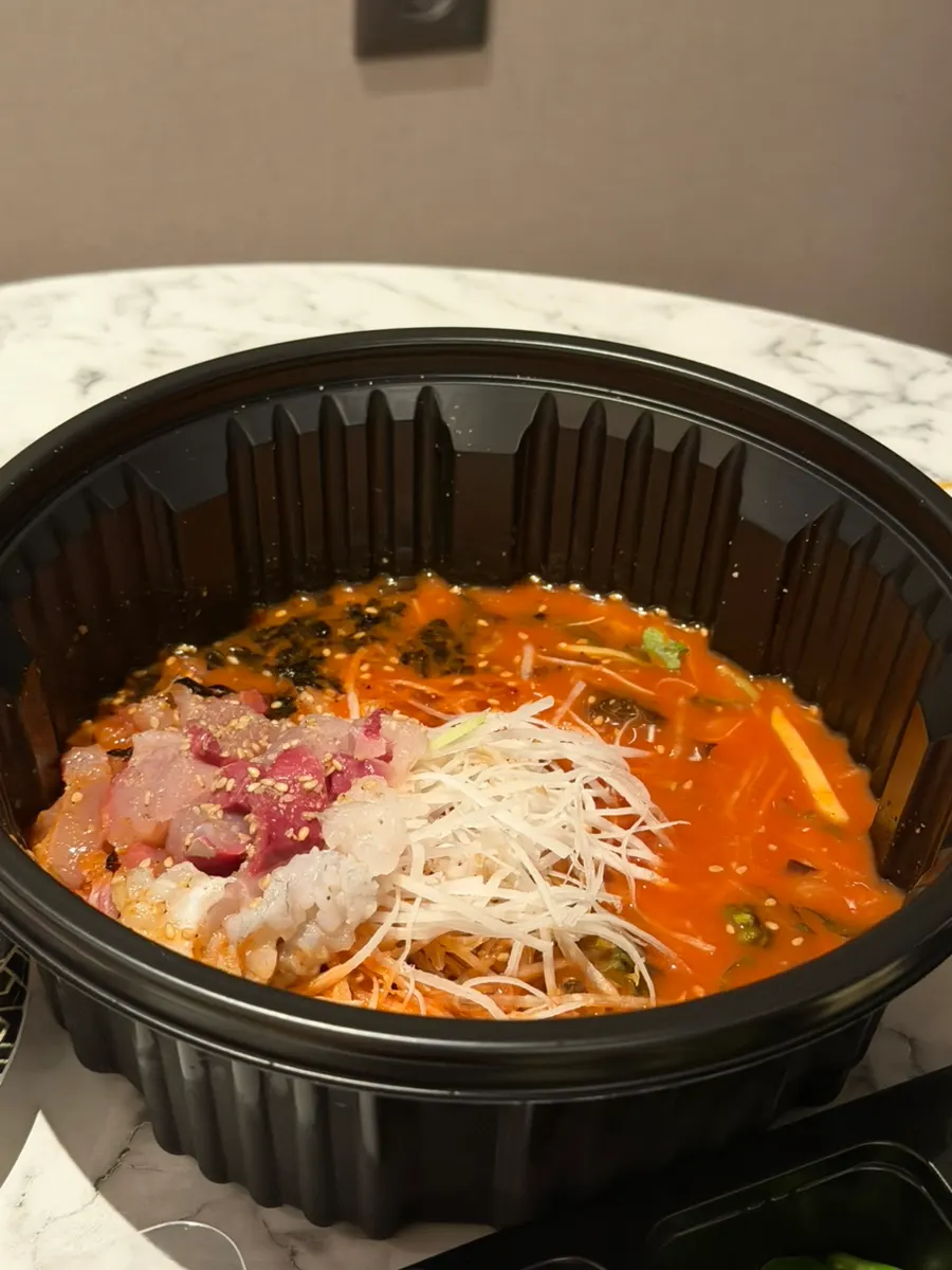 A full sashimi takeout spread with wrap vegetables