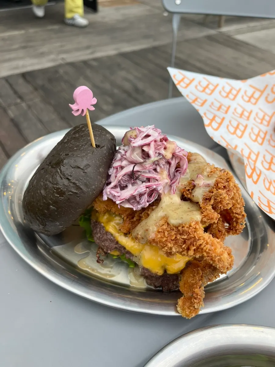 Burgers and side dishes ordered at Burger Bar