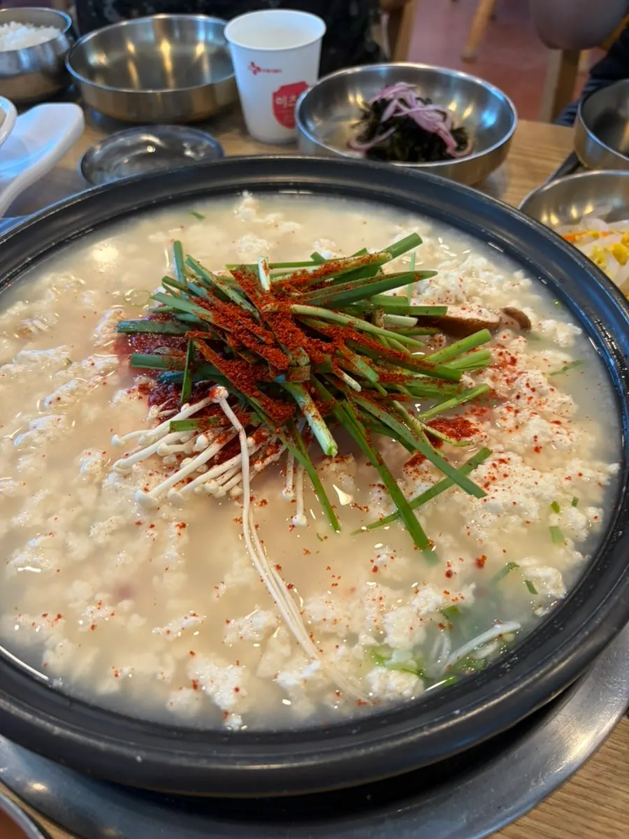 Sundubu jjigae broth spooned over rice