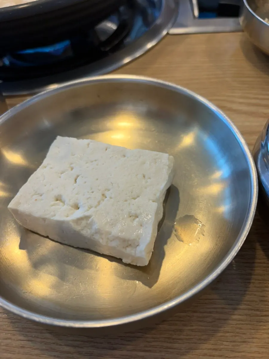 A piece of boiled pork with flatfish jeotgal