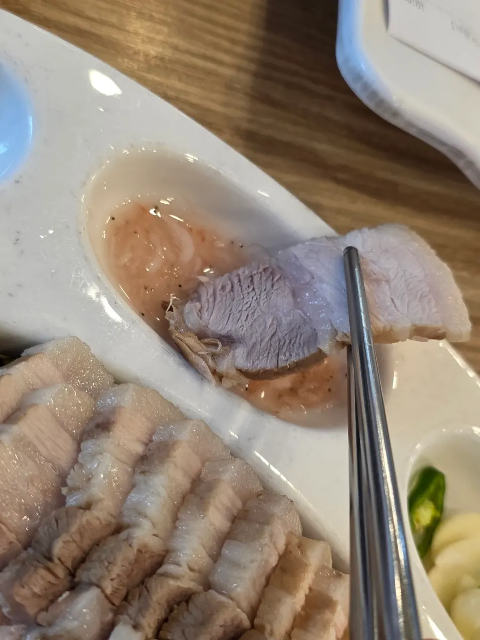 Bossam slice dipped in salted shrimp