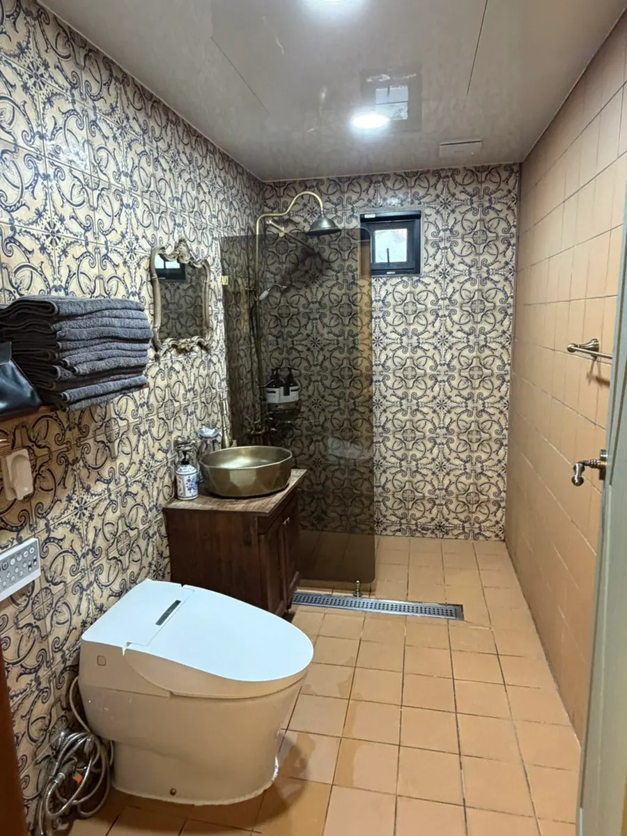 1st floor bathroom with a separated shower stall