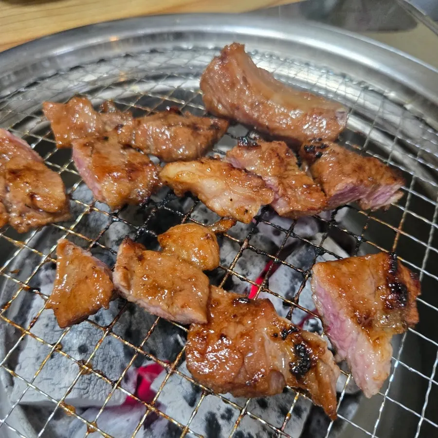 Marinated ribs cooking over charcoal
