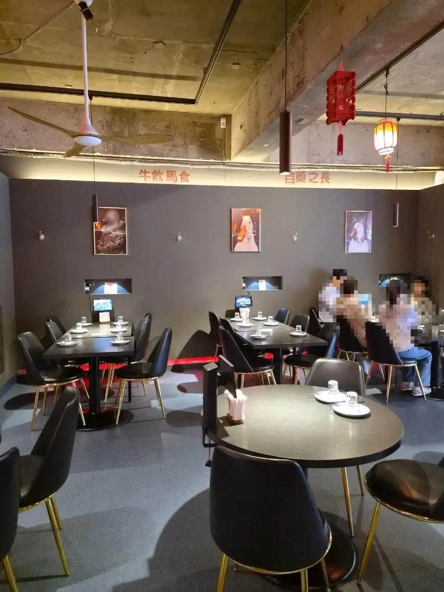 Dark-lit seating area inside Gang's Duck