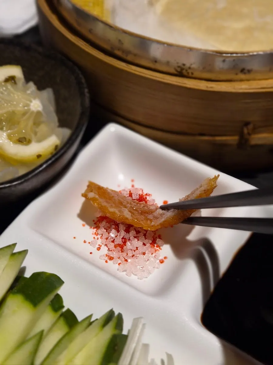 A piece of Peking duck showing its crispy skin