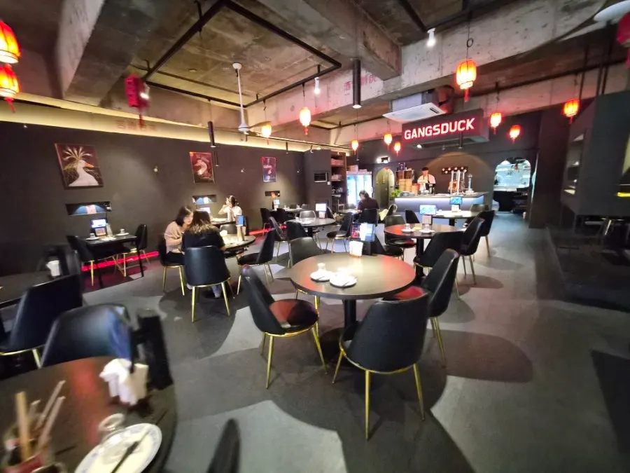 Table seating inside Gang's Duck