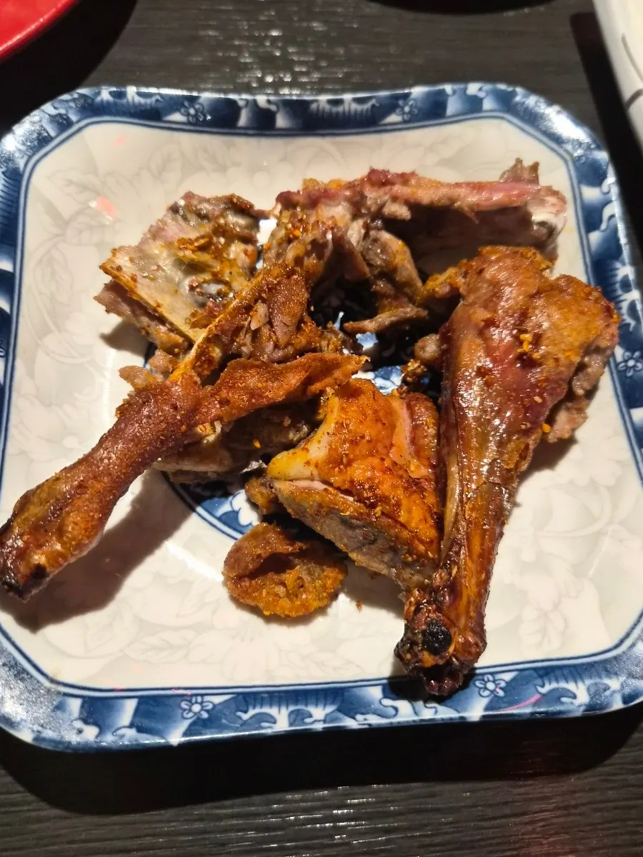 Fried duck leg seasoned with cumin-style spice