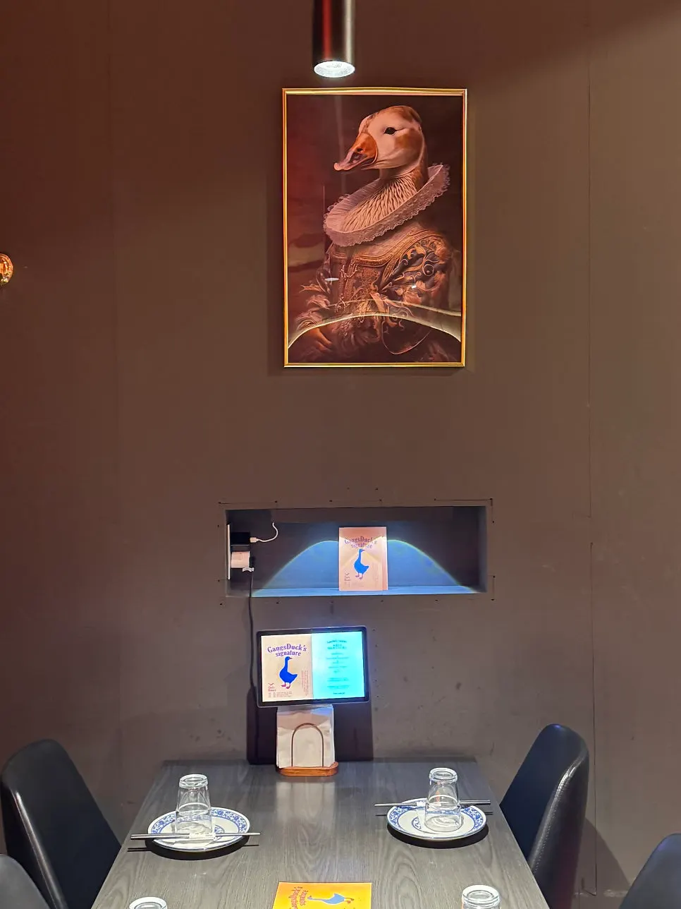 Framed duck portrait on the wall