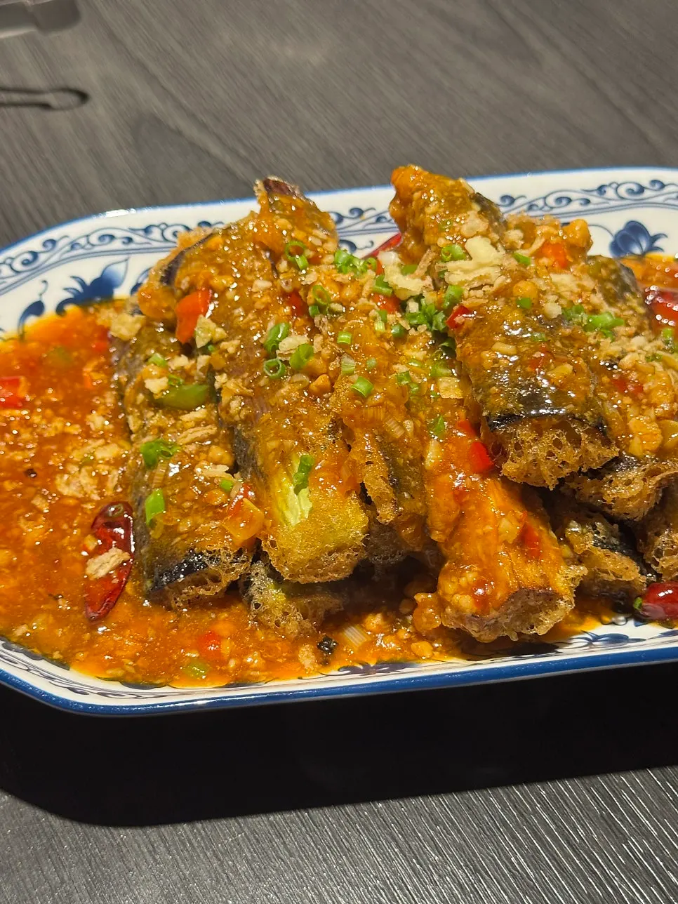 Fried yuxiang eggplant topped with sweet and tangy sauce