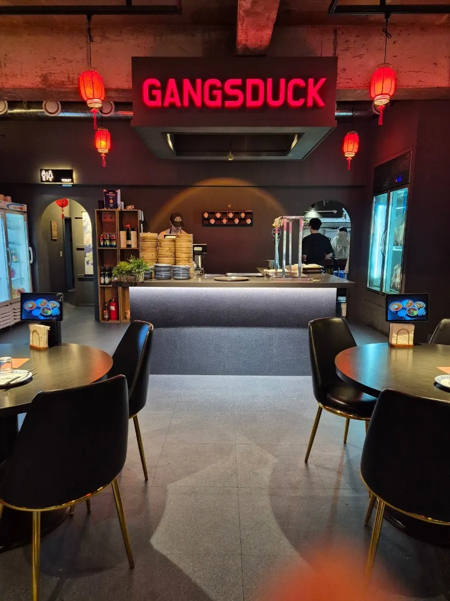 Interior of Gang's Duck with generously spaced tables