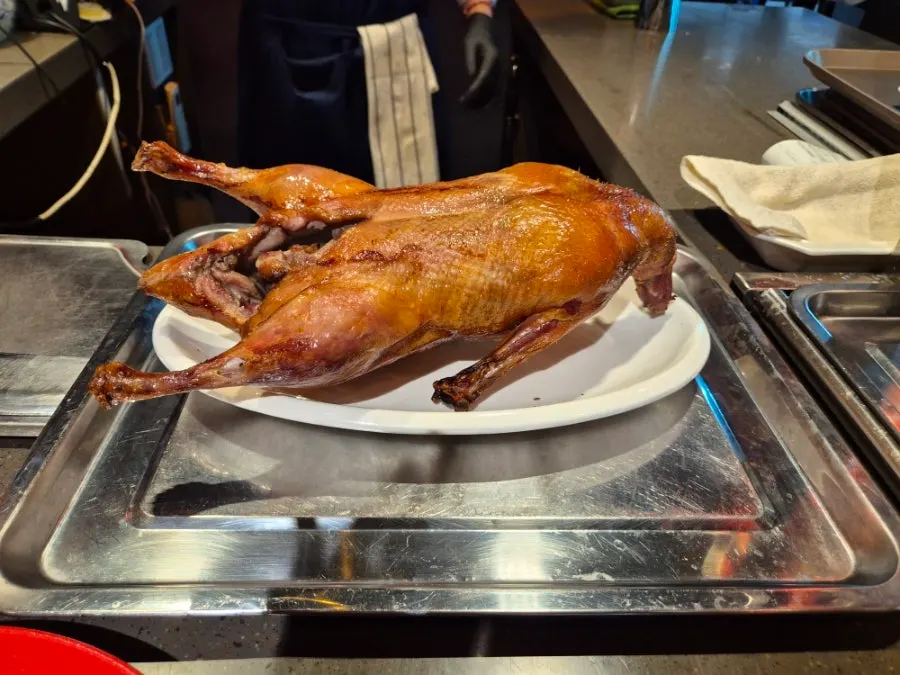 Peking duck fried rice mixed with a spoon