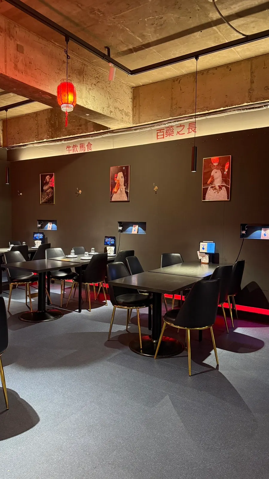 View of seating in the main hall at Gang's Duck