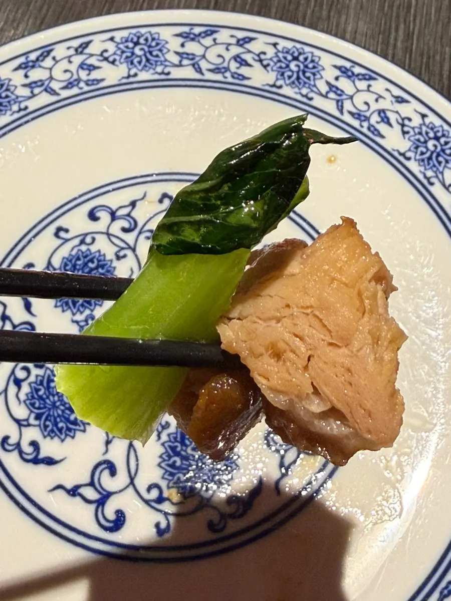 Dongpo-yuk plated with bok choy and bean sprouts