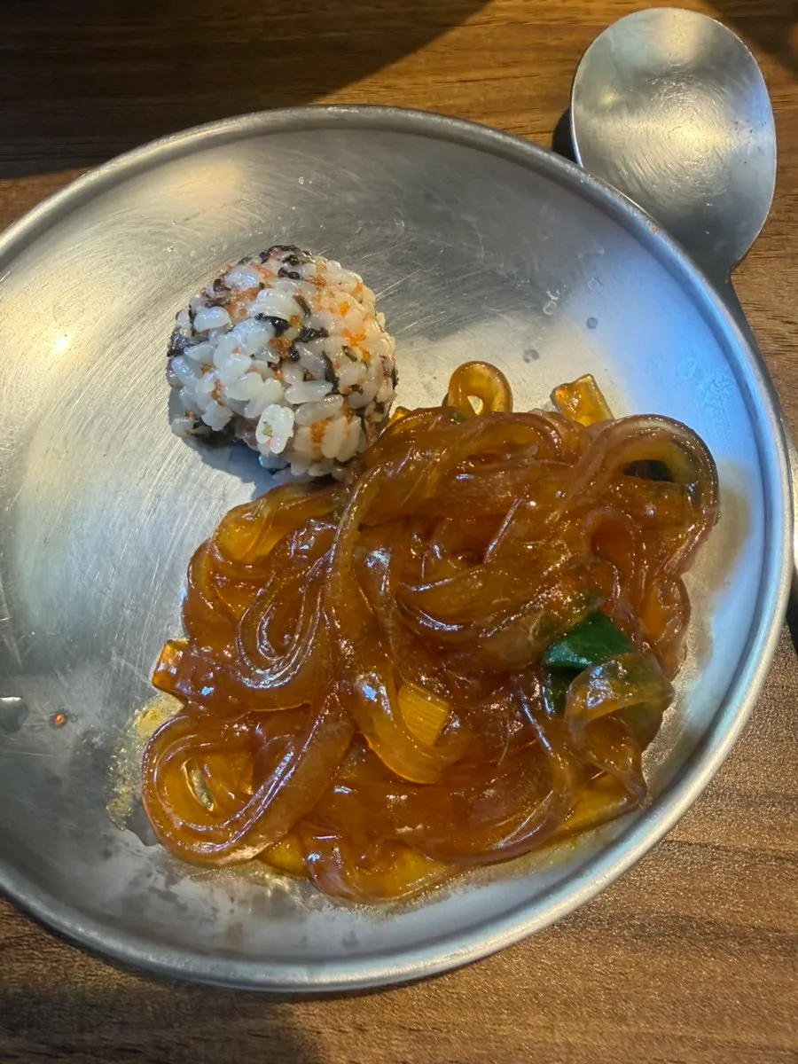 Nakgopsae enjoyed in a leafy wrap