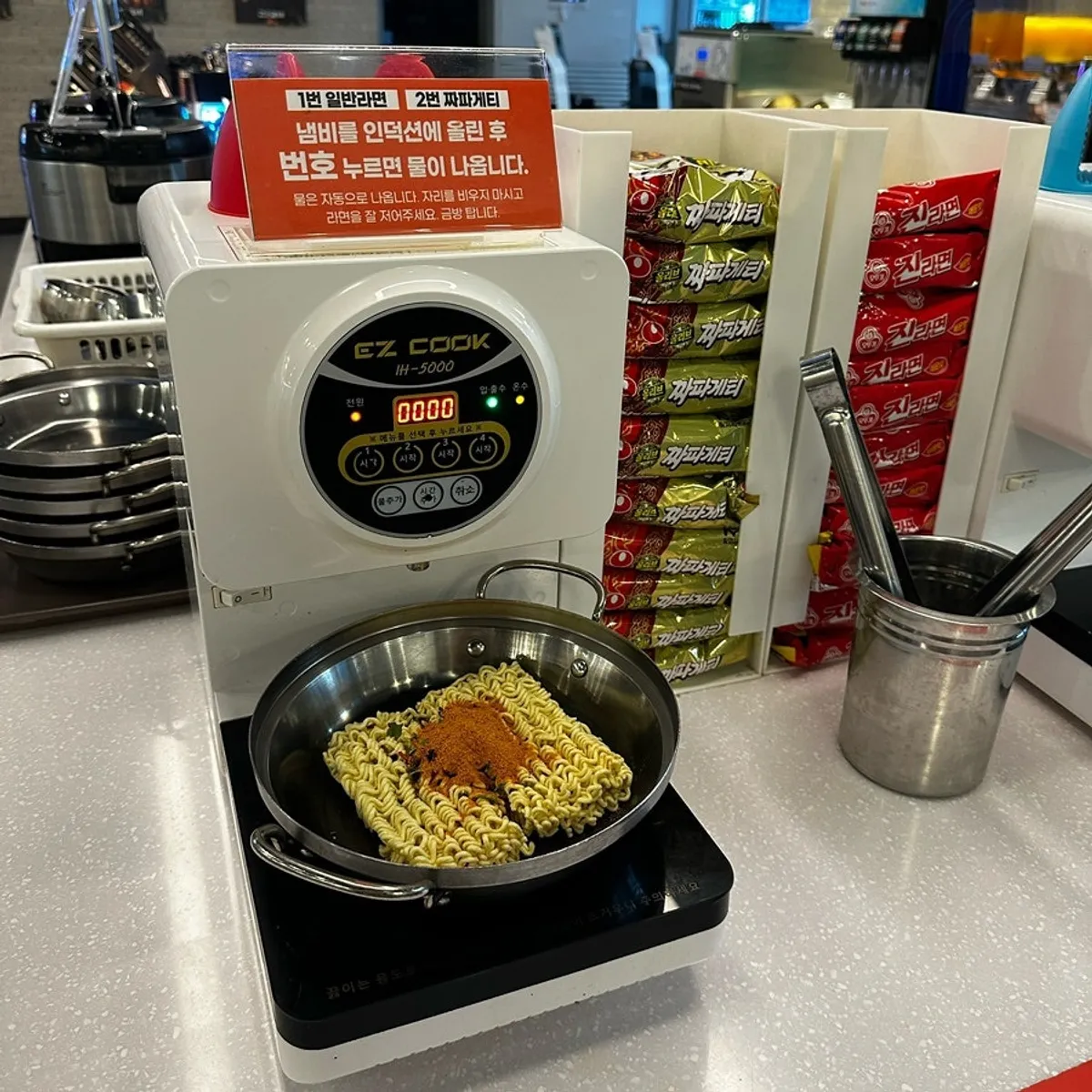 Self-serve bar at Gankeun Galbi with tteokbokki, chicken, and more