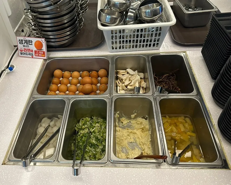 Self-serve bar corner with jjapaghetti and jin ramyeon