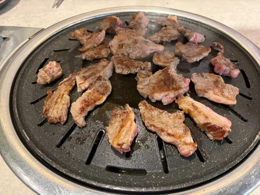 Meat laid out on the table at Gankeun Galbi Seongseo Branch