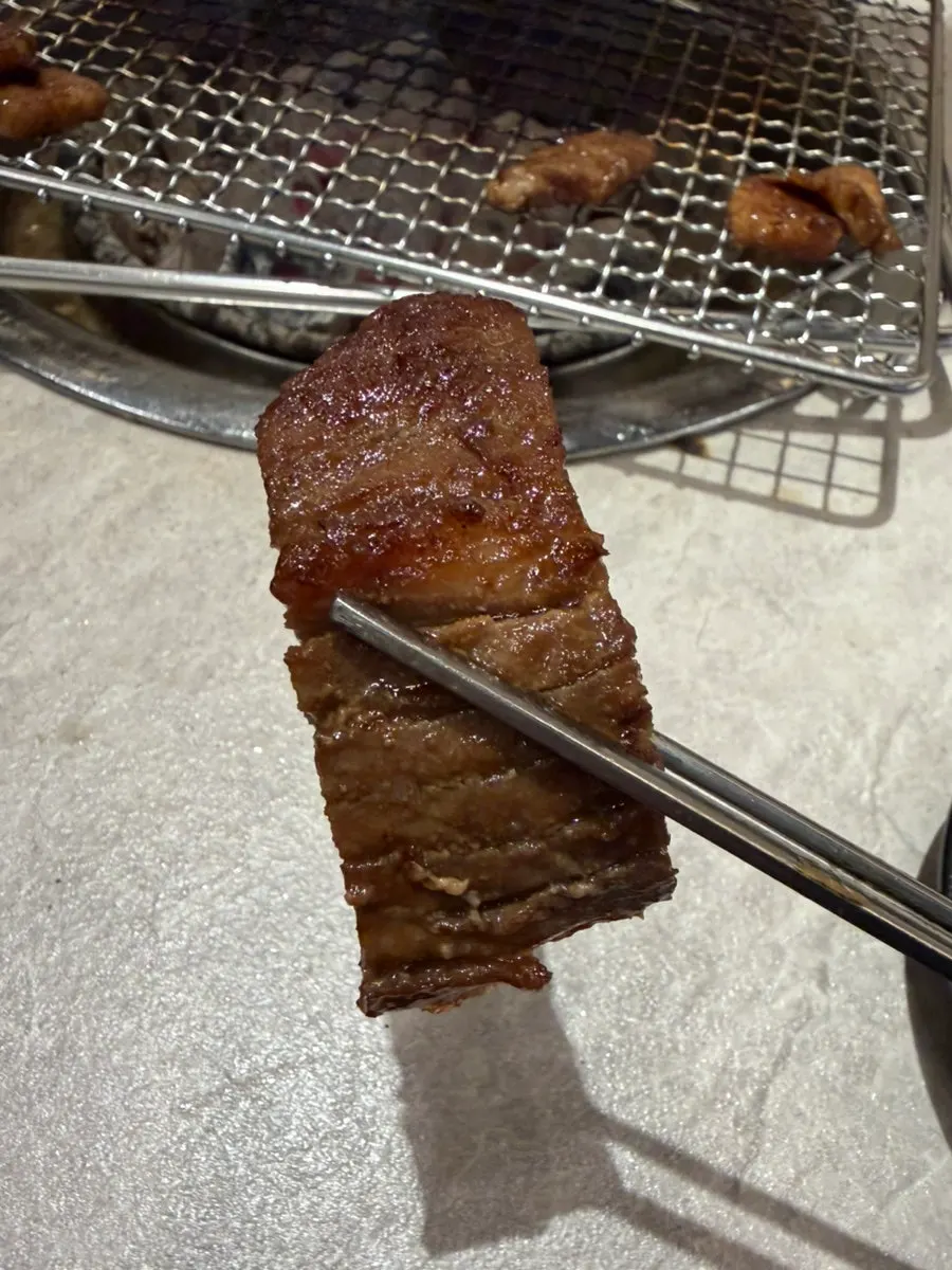 Pork ribs placed on a fresh grill plate