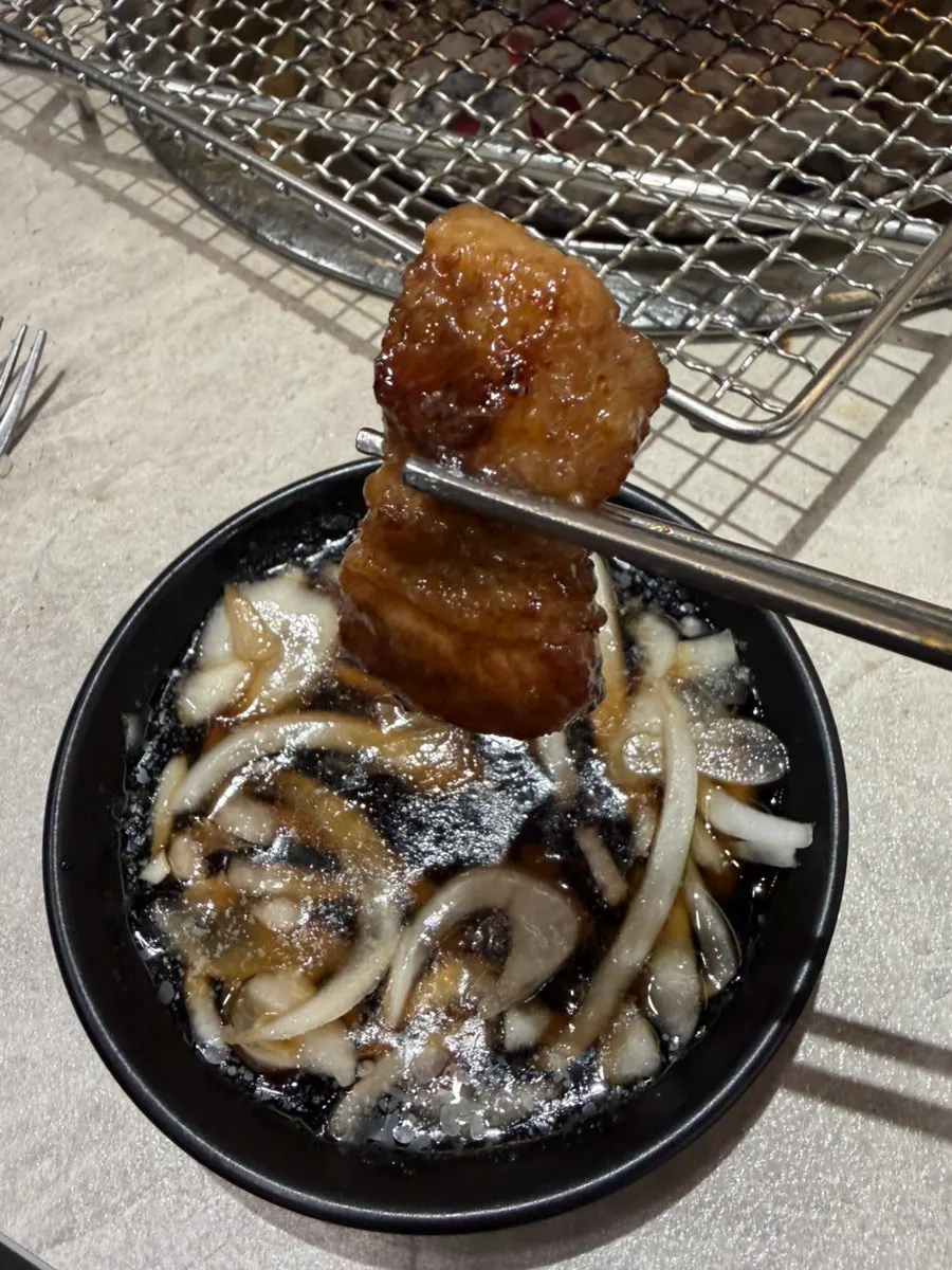Picking up a piece of pork rib