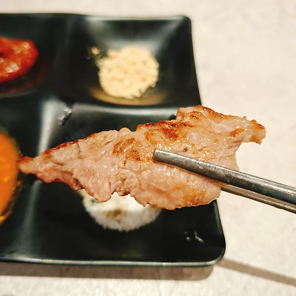 A piece of imperial beef short rib dipped in salt